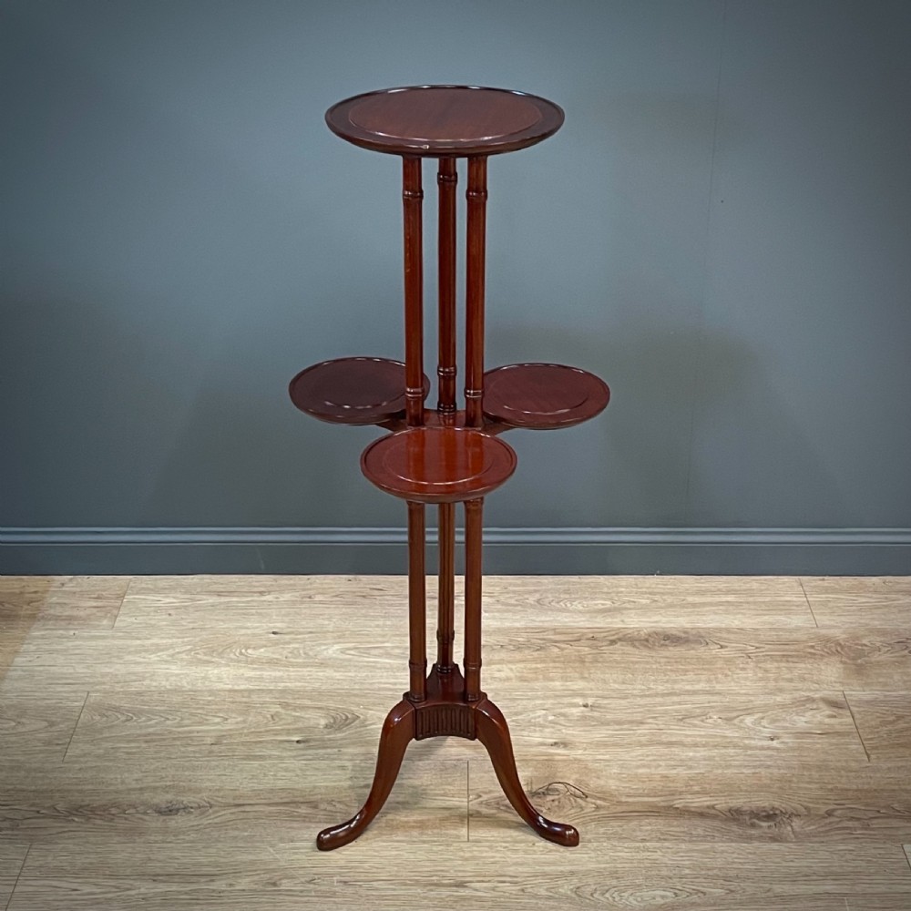 attractive mahogany plant cake stand with four trays