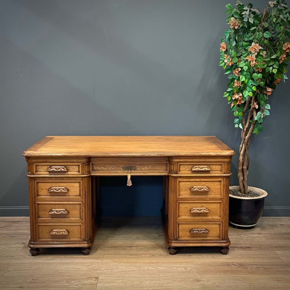 attractive very large antique carved light oak writing desk
