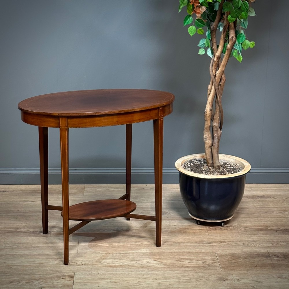 attractive small antique oval inlaid mahogany window side table