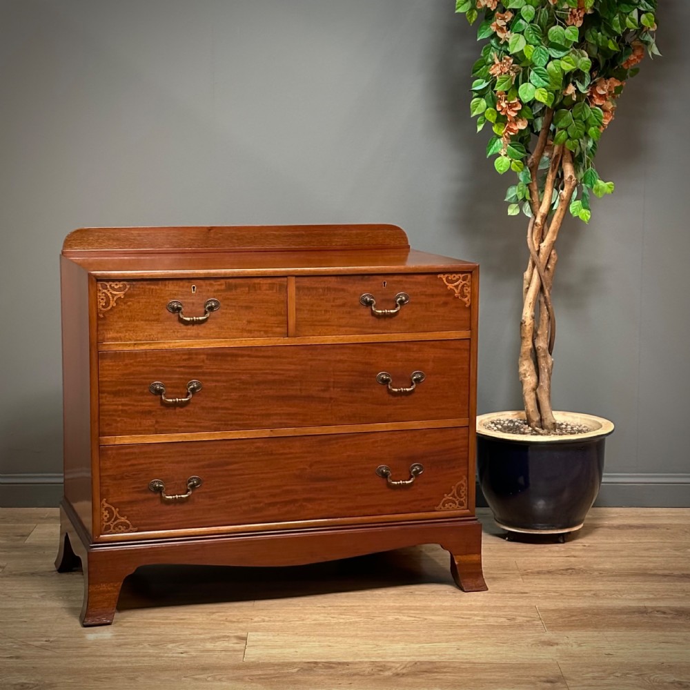 attractive antique mahogany chest of four graduated drawers