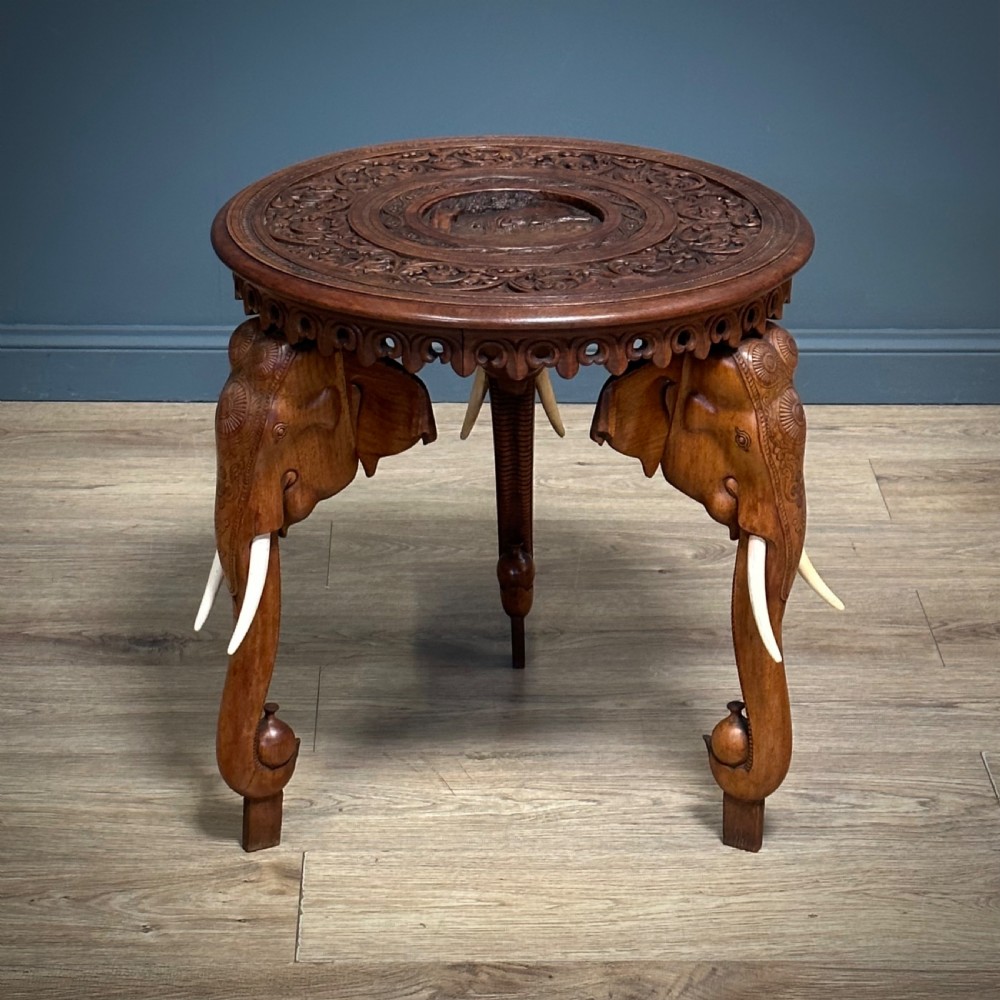 attractive antique heavily carved anglo indian elephant circular side table