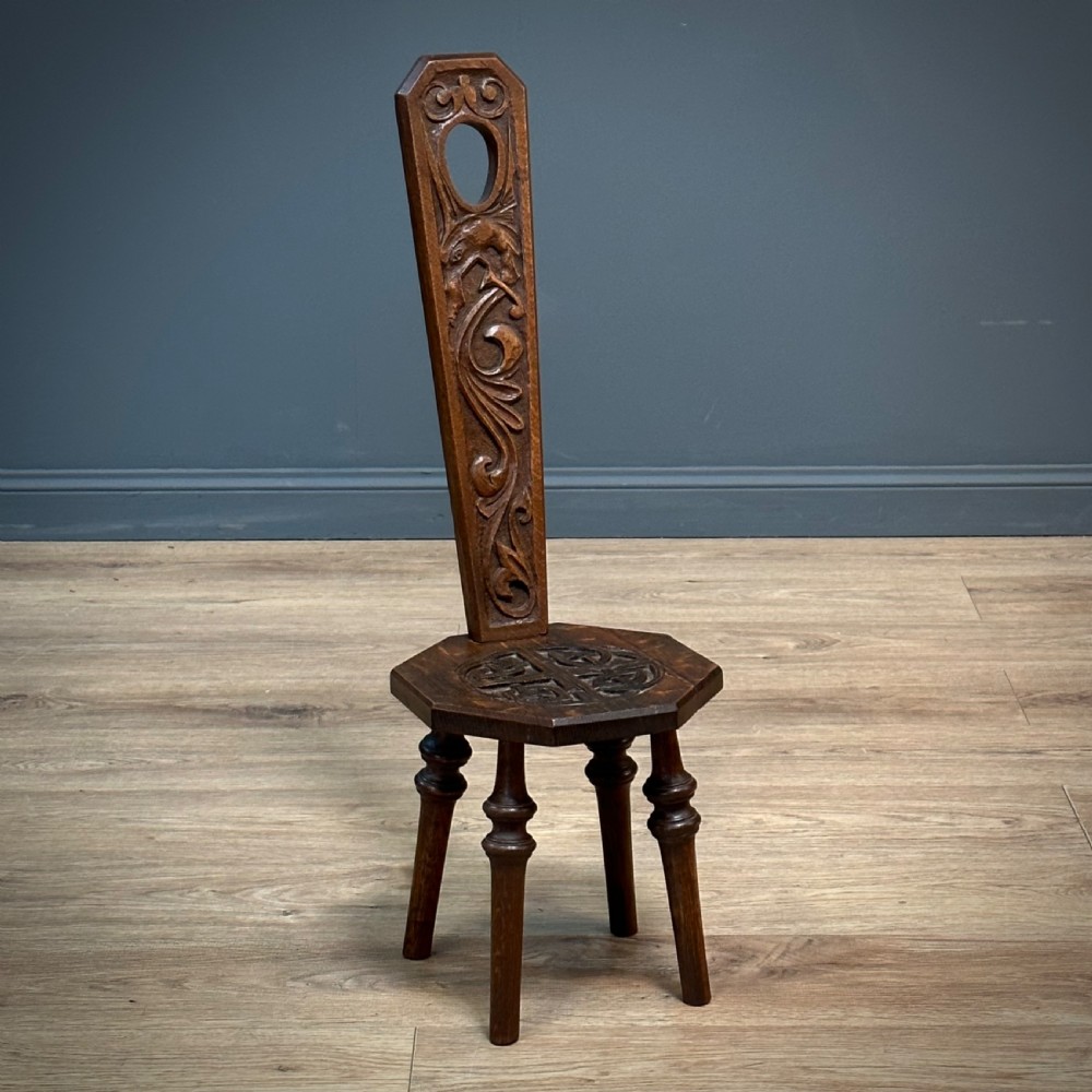 attractive small antique carved oak spinning chair