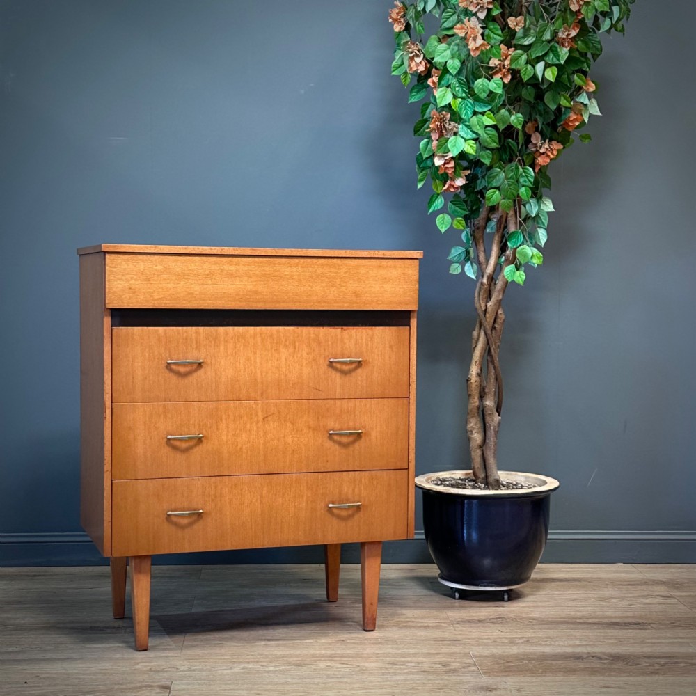 attractive mid century teak chest of four drawers