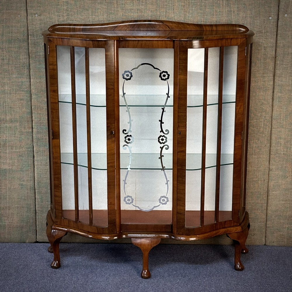 attractive vintage walnut two door serpentine display cabinet