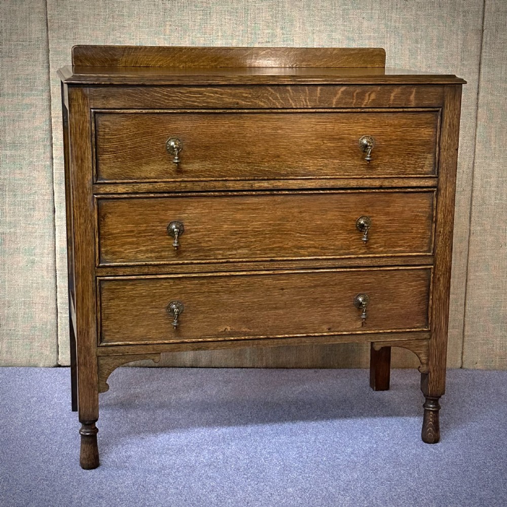 attractive antique oak chest of three drawers with gallery back