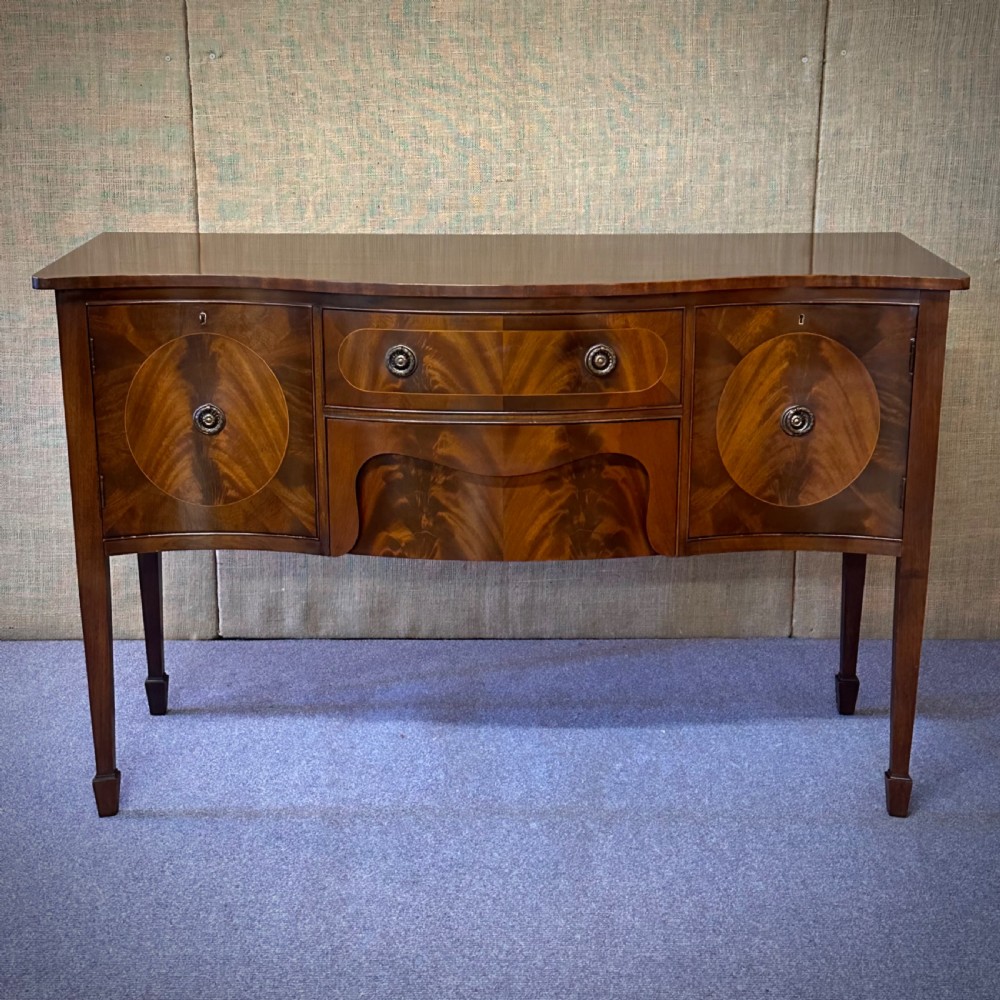 attractive flame mahogany serpentine front sideboard