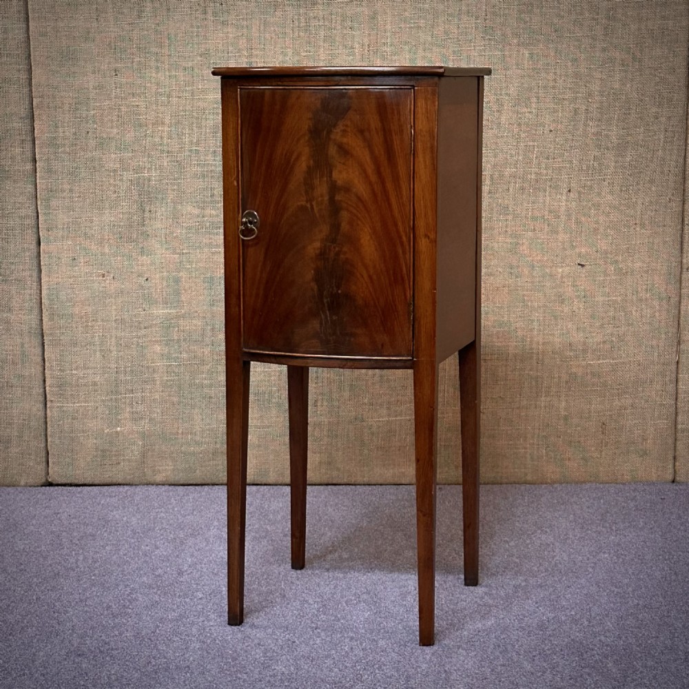 attractive tall slender antique flame mahogany bedside cabinet