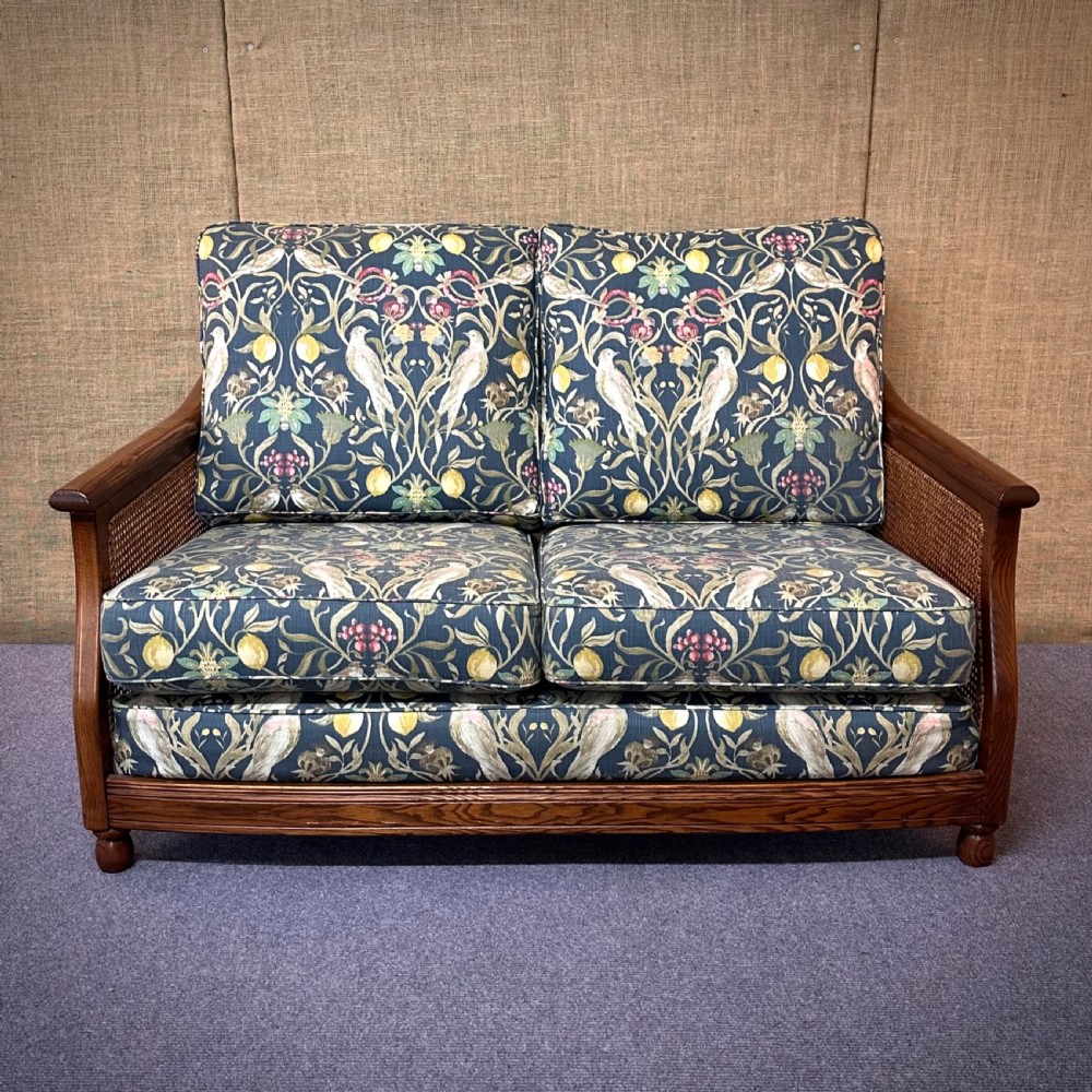 attractive large ercol bergere two seater settee