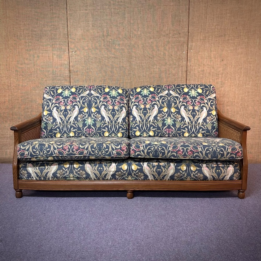 attractive large ercol bergere three seater settee