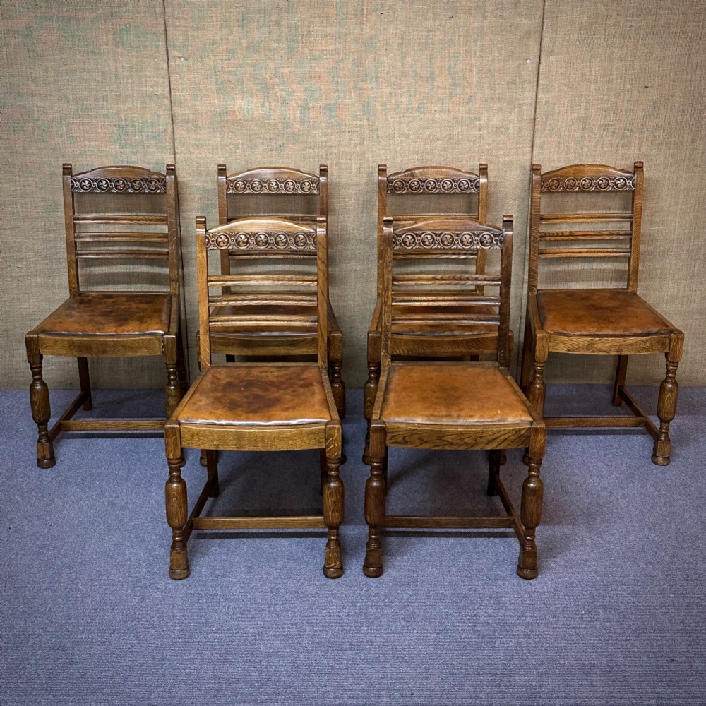 attractive set of six antique oak and leather dining chairs